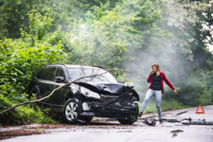 Lady with an accident damaged car that is still financed.